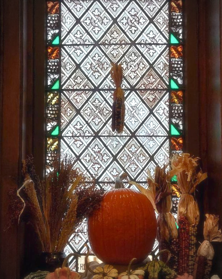 fall decorations in the church windows